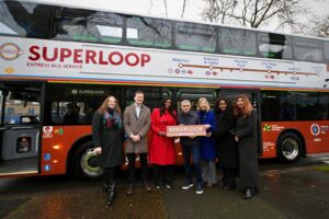 Mayor Sadiq Khan and councillors in front of a Bakerloop bus